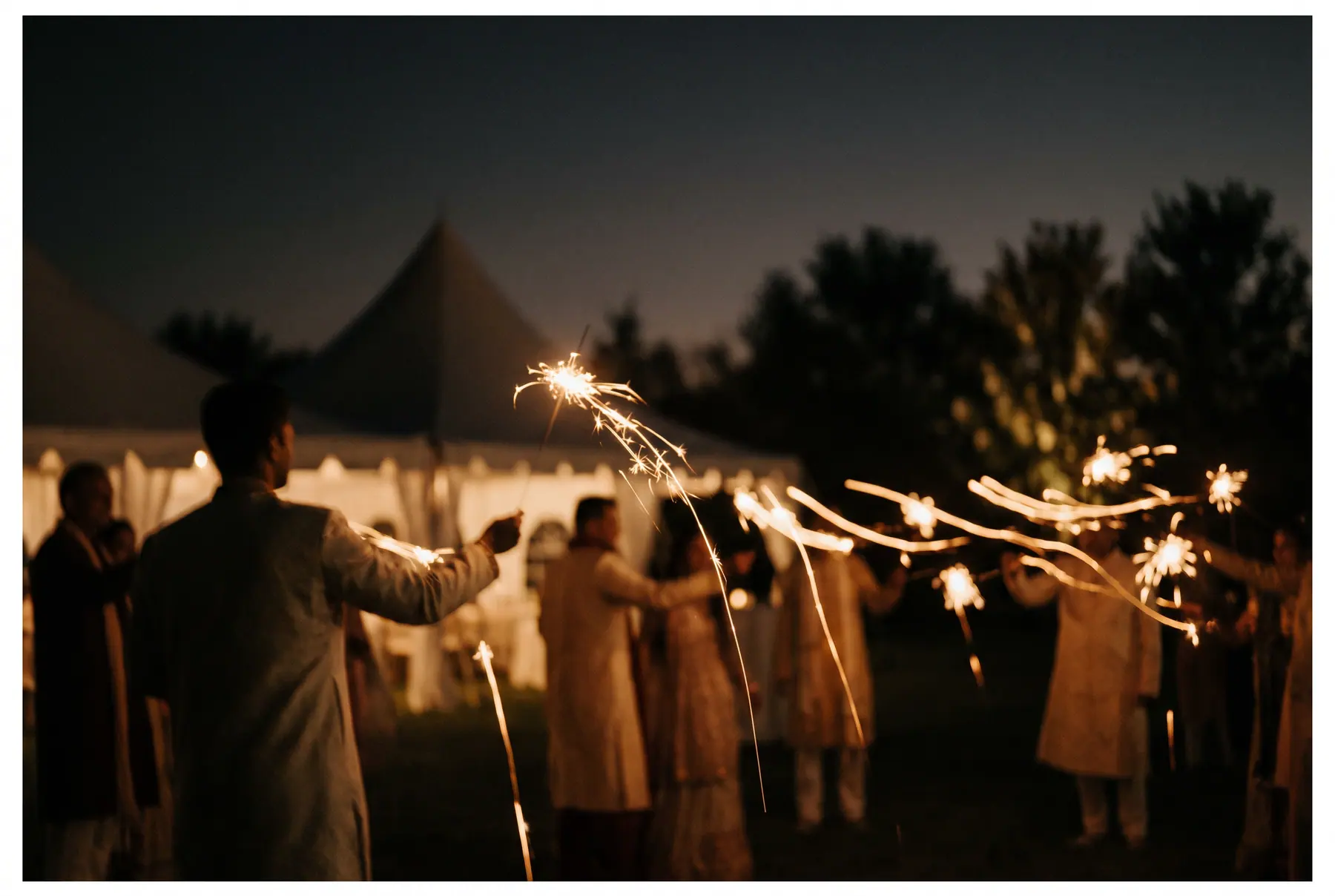 Sparklers and silhouettes at the end of the night.